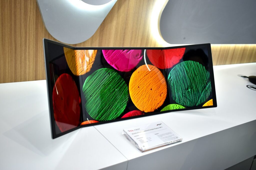 Curved-Monitor mit bunten abstrakten Formen